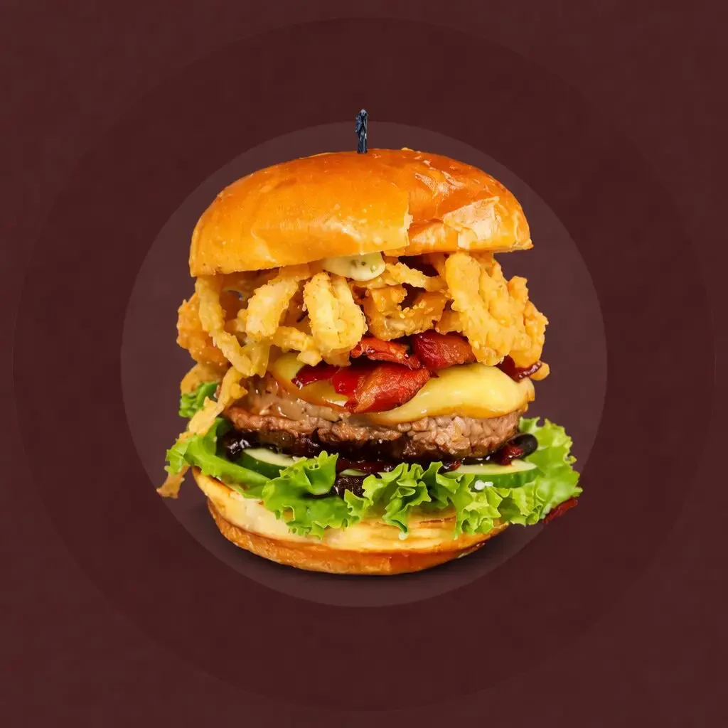 A loaded Basement Burger Bar build-your-own burger with crispy onion straws, bacon, and cheese